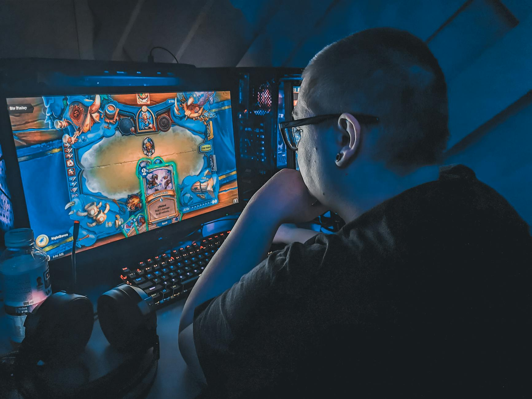 overweight man playing video game at night